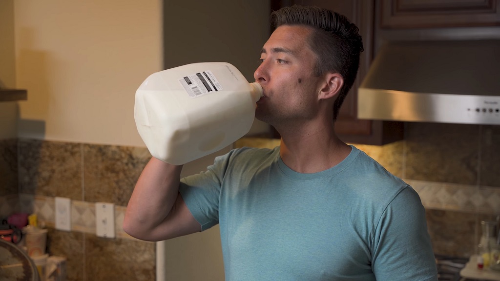 Guy is drinking raw milk